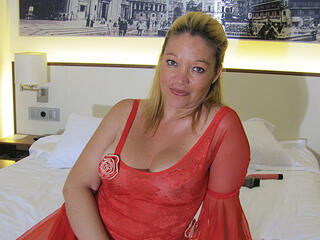 Big titted mama playing with herself