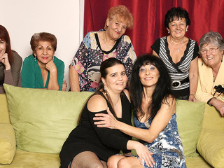 Old and young lesbians perform in a room full of mature ladies