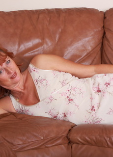 Naughty Red housewife playing with herself at Mature.nl