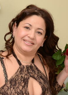 Naughty housewife teasing herself on the chair at Mature.nl