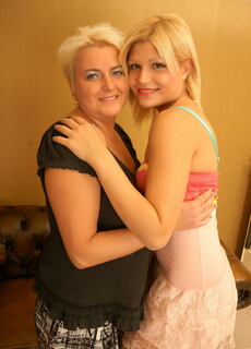 Old and young lesbians making out at the bar at Mature.nl
